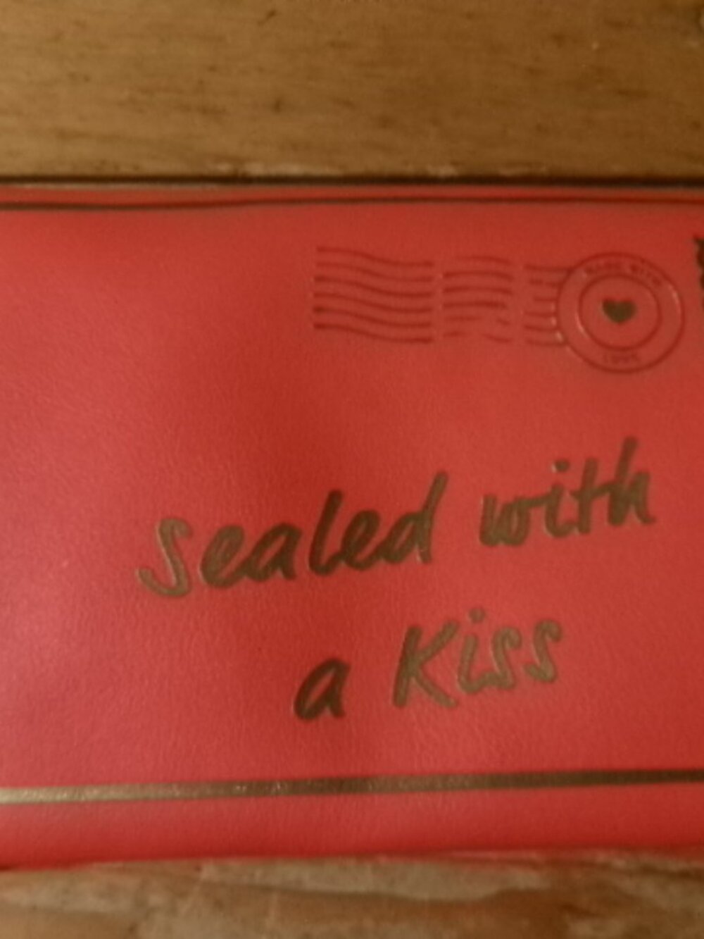 Sealed with a kiss bright orange snap front with brass kiss front makeup bag
